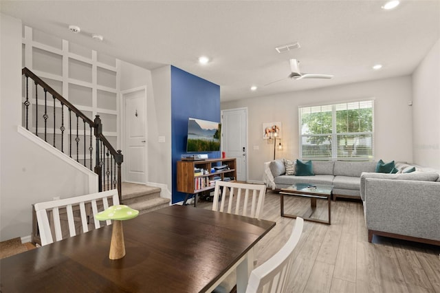 dining area with stairs, wood finished floors, recessed lighting, ceiling fan, and baseboards