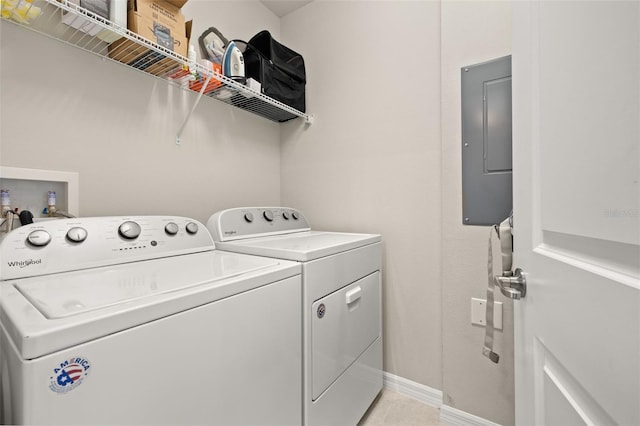 washroom featuring electric panel, independent washer and dryer, and baseboards