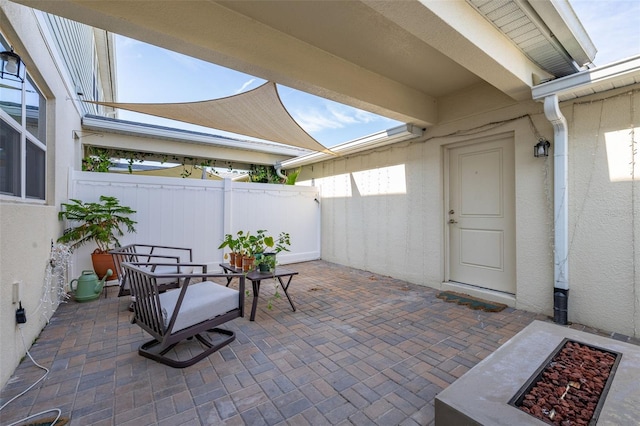 view of patio featuring fence