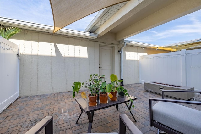 view of patio / terrace featuring fence