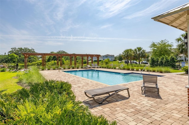 community pool with a pergola, a patio area, and fence