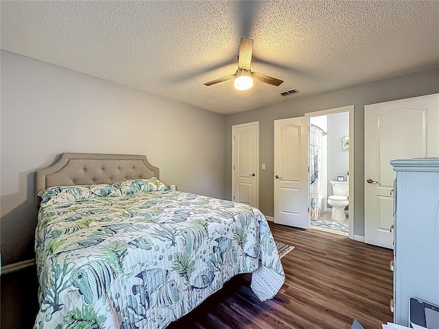 bedroom featuring visible vents, dark wood-style flooring, a textured ceiling, connected bathroom, and a ceiling fan