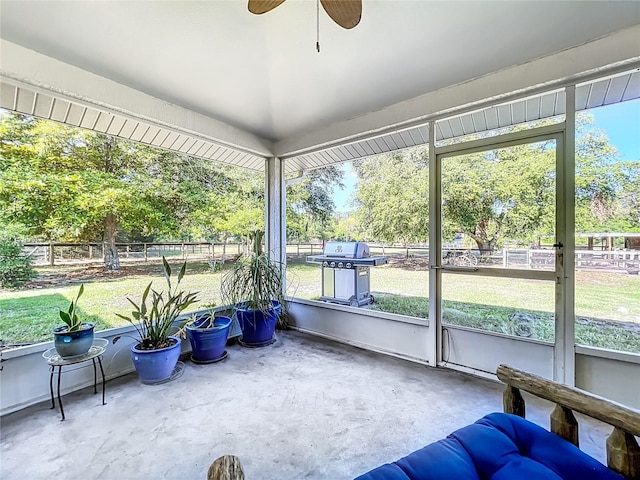 sunroom / solarium with ceiling fan