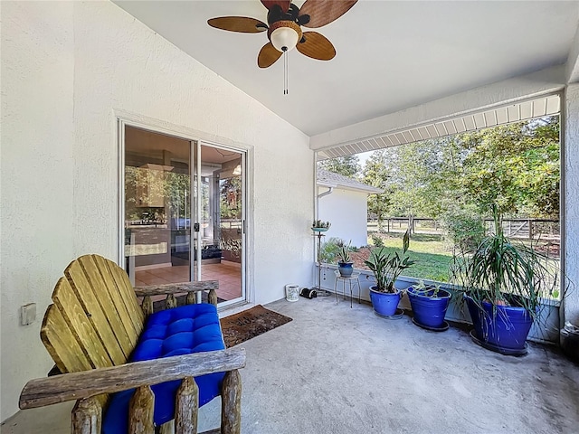 sunroom with a ceiling fan