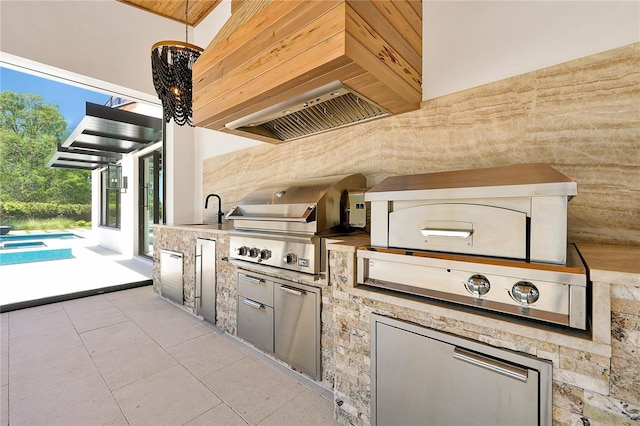 5525 Isleworth Country Club Dr, Windermere, FL 34786 - view of patio featuring a grill, exterior kitchen, and a sink