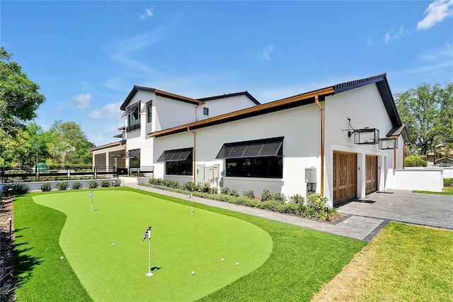 5525 Isleworth Country Club Dr, Windermere, FL 34786 - surrounding community with an area to practice putting, fence, and driveway