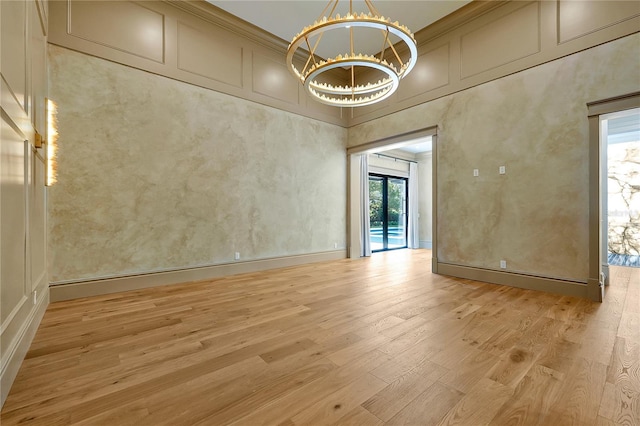 5525 Isleworth Country Club Dr, Windermere, FL 34786 - spare room featuring healthy amount of natural light, light wood finished floors, a chandelier, and a towering ceiling
