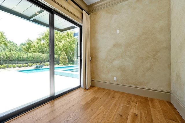 5525 Isleworth Country Club Dr, Windermere, FL 34786 - spare room featuring light wood-style flooring, baseboards, and crown molding