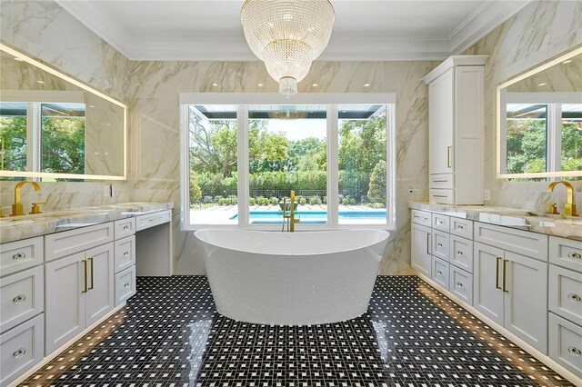 5525 Isleworth Country Club Dr, Windermere, FL 34786 - bathroom featuring plenty of natural light, ornamental molding, a soaking tub, a chandelier, and two vanities