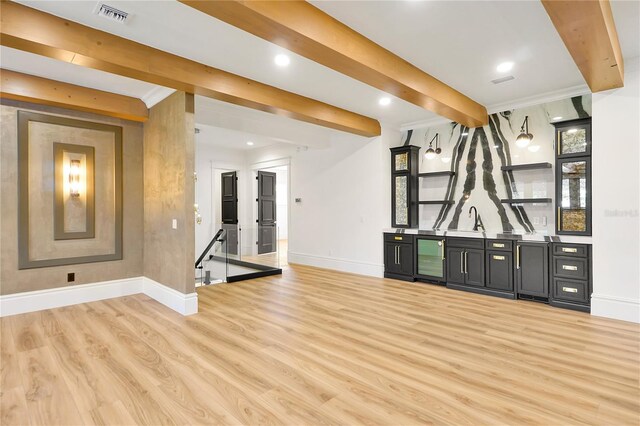 5525 Isleworth Country Club Dr, Windermere, FL 34786 - unfurnished living room with baseboards, bar with sink, light wood-type flooring, beverage cooler, and beamed ceiling