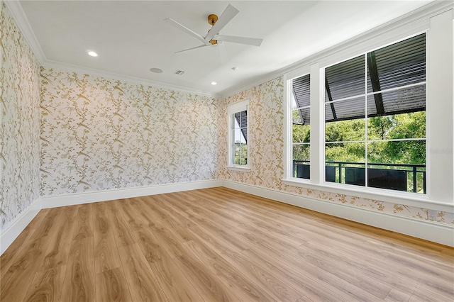 5525 Isleworth Country Club Dr, Windermere, FL 34786 - spare room with ornamental molding, light wood finished floors, wallpapered walls, a ceiling fan, and baseboards
