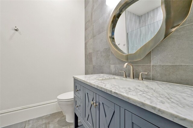 5525 Isleworth Country Club Dr, Windermere, FL 34786 - bathroom featuring vanity, tile walls, and toilet