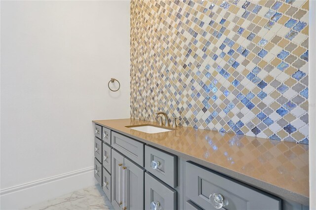 5525 Isleworth Country Club Dr, Windermere, FL 34786 - bathroom with a sink, marble look tile flooring, and tasteful backsplash