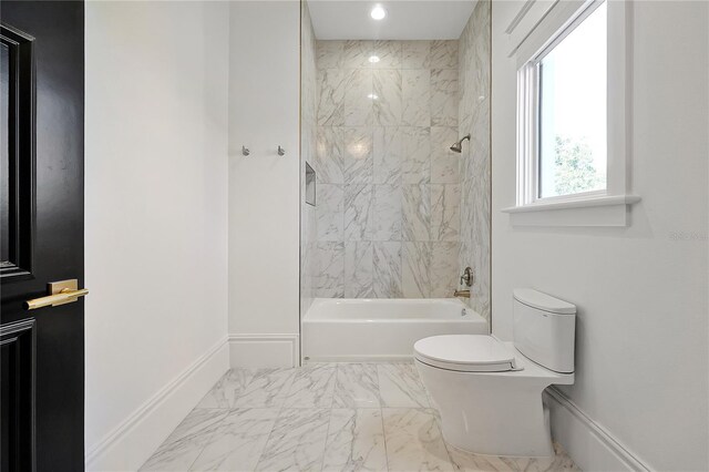 5525 Isleworth Country Club Dr, Windermere, FL 34786 - full bath featuring marble look tiles, toilet, bathing tub / shower combination, and baseboards