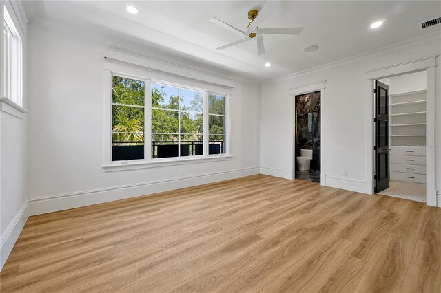 5525 Isleworth Country Club Dr, Windermere, FL 34786 - unfurnished bedroom with ornamental molding, wood finished floors, recessed lighting, baseboards, and a spacious closet