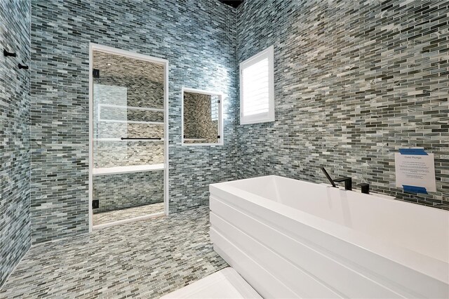 5525 Isleworth Country Club Dr, Windermere, FL 34786 - full bath with tile walls, tiled shower, and a bathtub