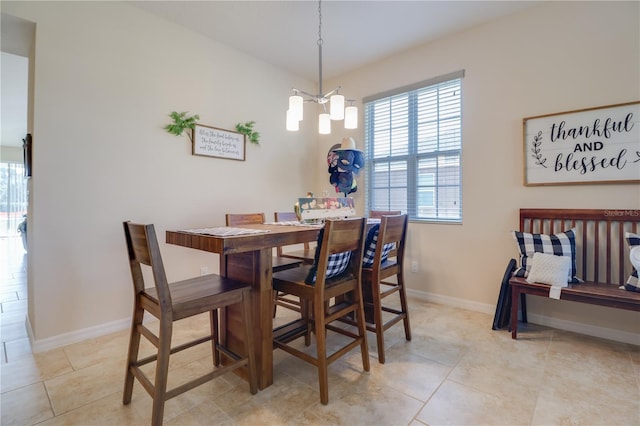 dining space with baseboards, an inviting chandelier, and light tile patterned floors