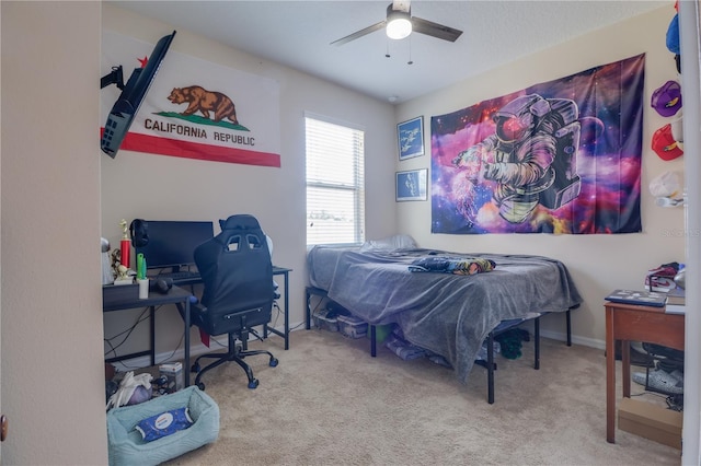 carpeted bedroom with a ceiling fan