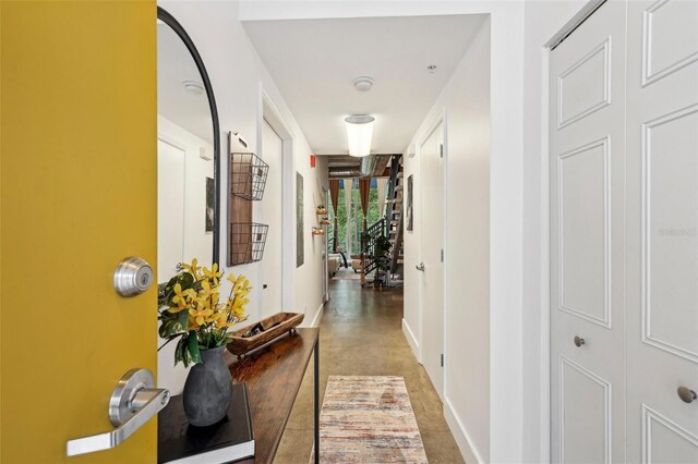 hallway featuring baseboards