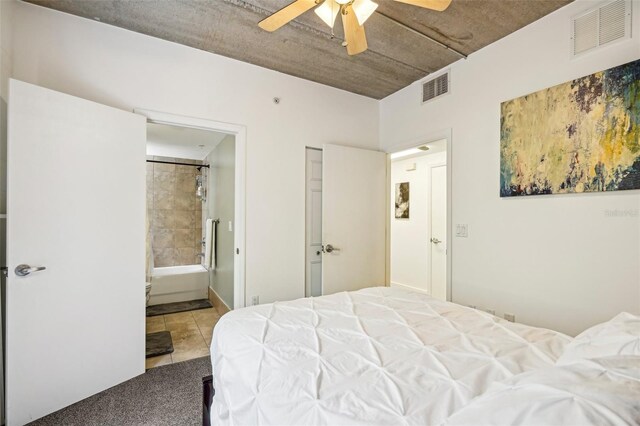 bedroom with visible vents, a ceiling fan, carpet, and ensuite bathroom