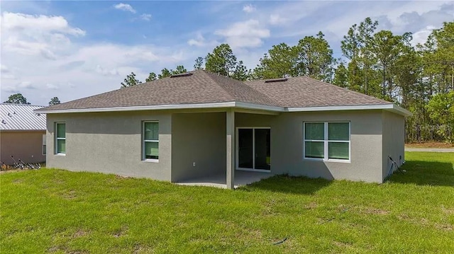 8312 N Pitcairn Way, Citrus Springs, FL 34434 - rear view of property with stucco siding, roof with shingles, a patio area, and a lawn