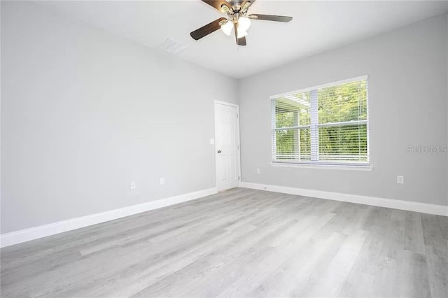 8312 N Pitcairn Way, Citrus Springs, FL 34434 - unfurnished room featuring wood finished floors, baseboards, and ceiling fan