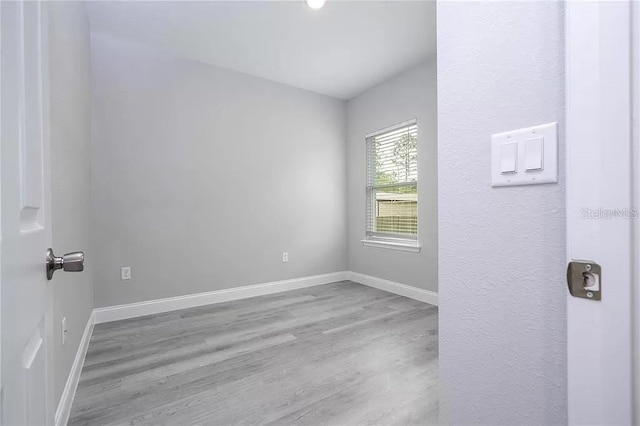 8312 N Pitcairn Way, Citrus Springs, FL 34434 - empty room featuring wood finished floors and baseboards
