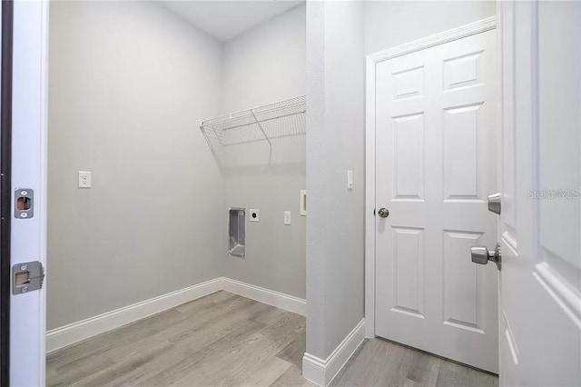 8312 N Pitcairn Way, Citrus Springs, FL 34434 - laundry room with attic access, electric dryer hookup, light wood-style floors, and baseboards
