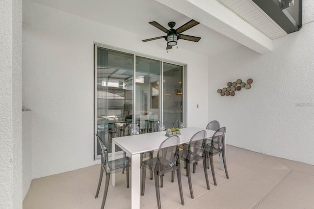 view of patio / terrace with a ceiling fan and outdoor dining area