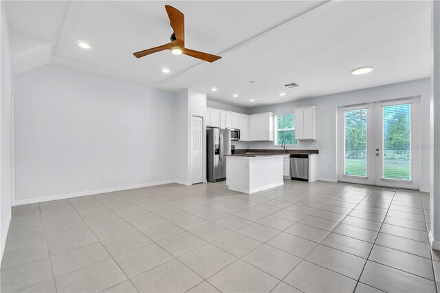 unfurnished living room with visible vents, light tile patterned flooring, baseboards, ceiling fan, and recessed lighting