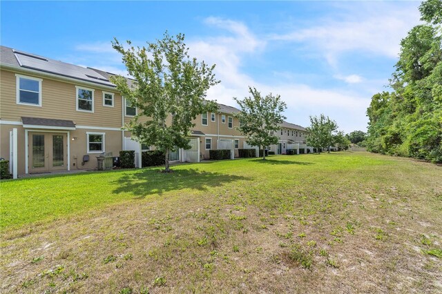 view of yard with french doors