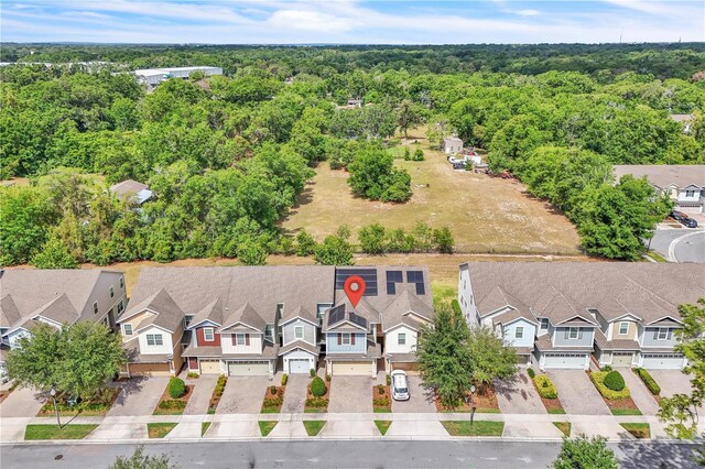 bird's eye view with a residential view and a forest view