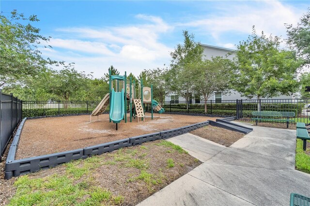 communal playground featuring fence