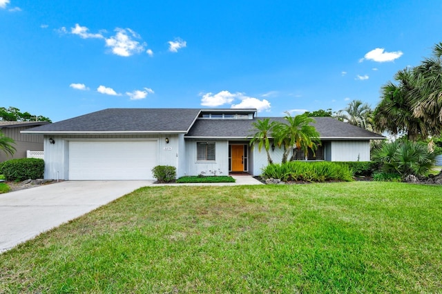 3379 Monika Cir, Orlando, FL 32812 - view of front of house featuring a garage, a shingled roof, a front yard, and concrete driveway