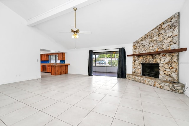 3379 Monika Cir, Orlando, FL 32812 - unfurnished living room featuring ceiling fan, beam ceiling, high vaulted ceiling, a stone fireplace, and light tile patterned floors