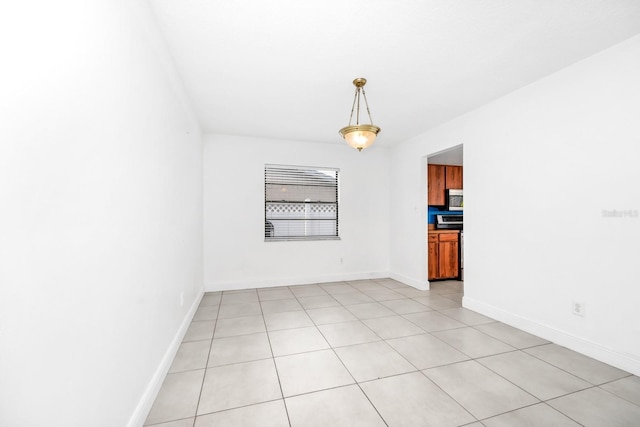 3379 Monika Cir, Orlando, FL 32812 - empty room featuring baseboards and light tile patterned floors