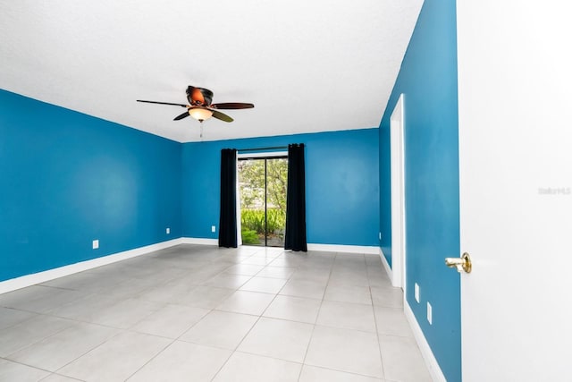 3379 Monika Cir, Orlando, FL 32812 - unfurnished room with light tile patterned flooring, ceiling fan, and baseboards