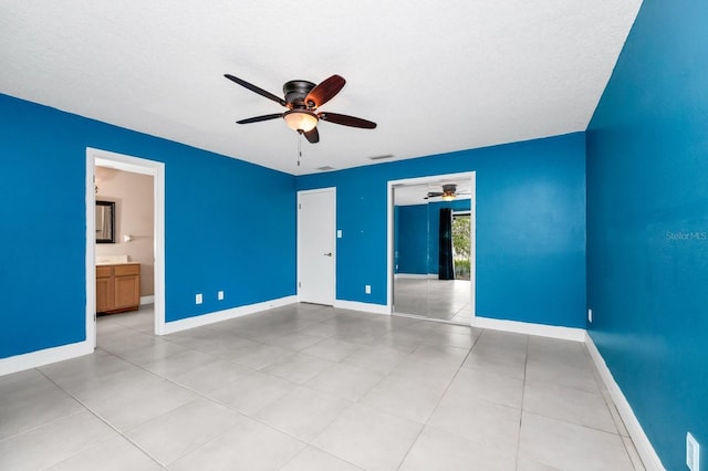 3379 Monika Cir, Orlando, FL 32812 - unfurnished bedroom featuring a ceiling fan, baseboards, visible vents, and light tile patterned floors