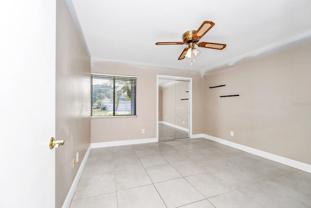 3379 Monika Cir, Orlando, FL 32812 - unfurnished bedroom featuring baseboards, ceiling fan, and a closet