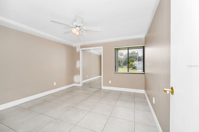 3379 Monika Cir, Orlando, FL 32812 - unfurnished room with baseboards, ceiling fan, and light tile patterned floors