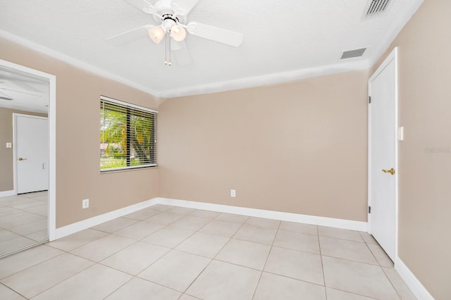 3379 Monika Cir, Orlando, FL 32812 - unfurnished room featuring visible vents, a ceiling fan, baseboards, and light tile patterned floors