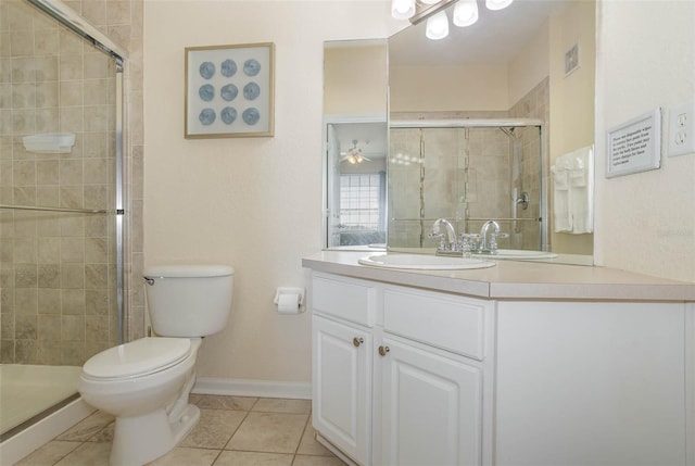 full bathroom featuring toilet, a stall shower, visible vents, baseboards, and vanity