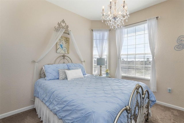 bedroom with a chandelier, carpet, and baseboards