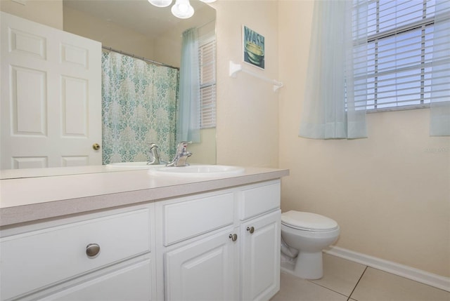 bathroom with toilet, a shower with shower curtain, tile patterned floors, baseboards, and vanity