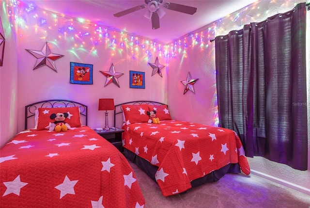 carpeted bedroom featuring a ceiling fan