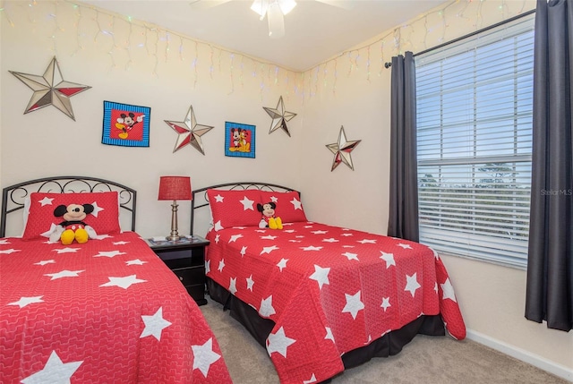 bedroom featuring carpet flooring, baseboards, and a ceiling fan