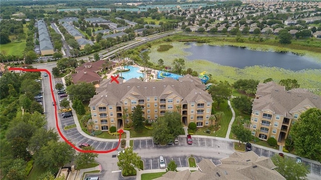 birds eye view of property with a water view