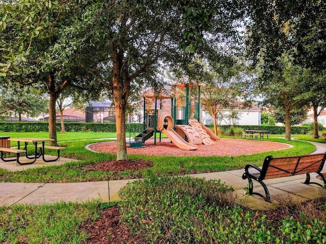 community playground featuring a lawn