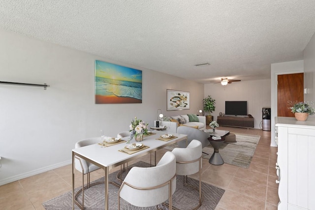 206 Diamond Cv Unit 106, Casselberry, FL 32707 - dining room with light tile patterned floors, ceiling fan, and a textured ceiling