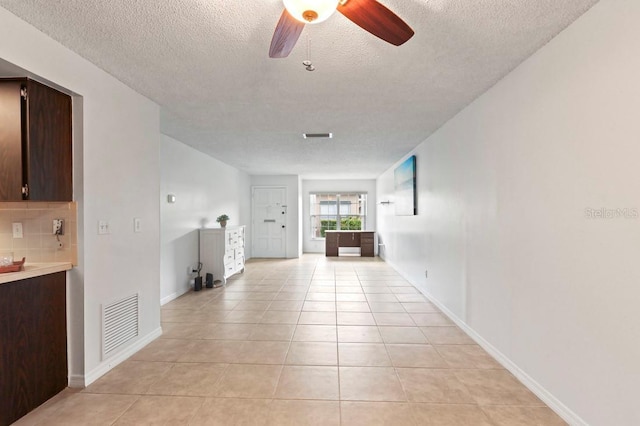 206 Diamond Cv Unit 106, Casselberry, FL 32707 - hall featuring visible vents, baseboards, a textured ceiling, and light tile patterned floors